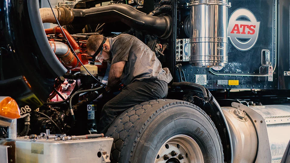 Mechanic working on a diesel engine