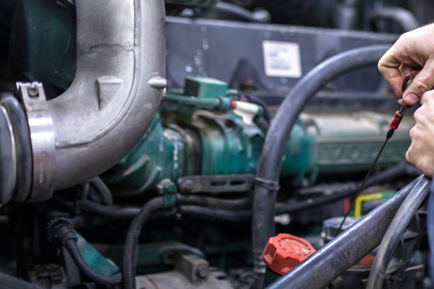 Diesel mechanic performing maintenance